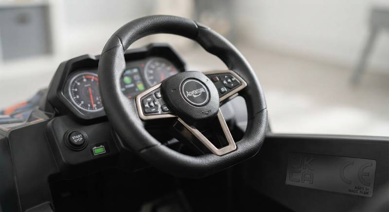 Close-up of a high-quality kids ride-on car dashboard featuring compliant UKCA safety standards